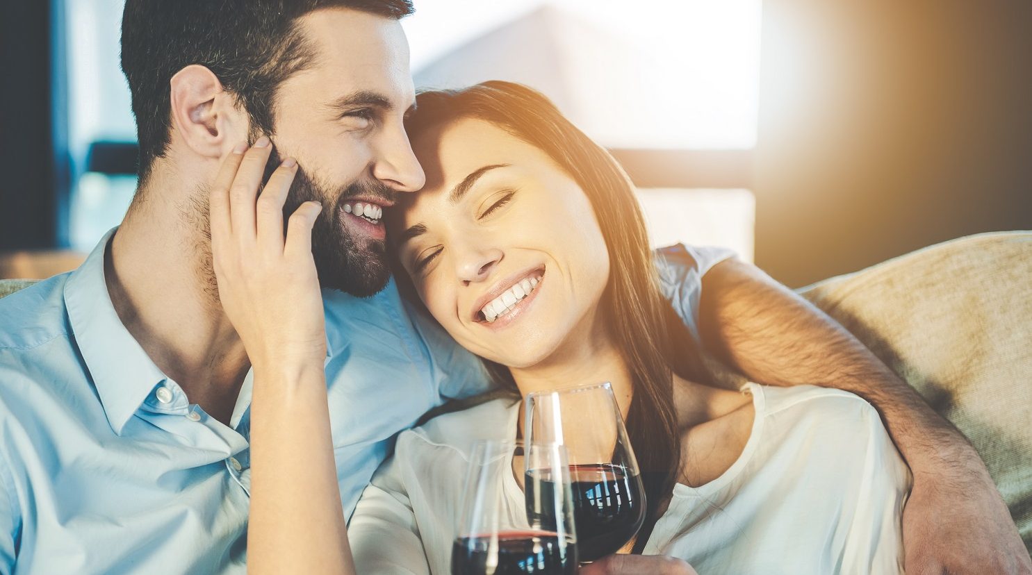 Couple drinking wine during romantic fall getaway
