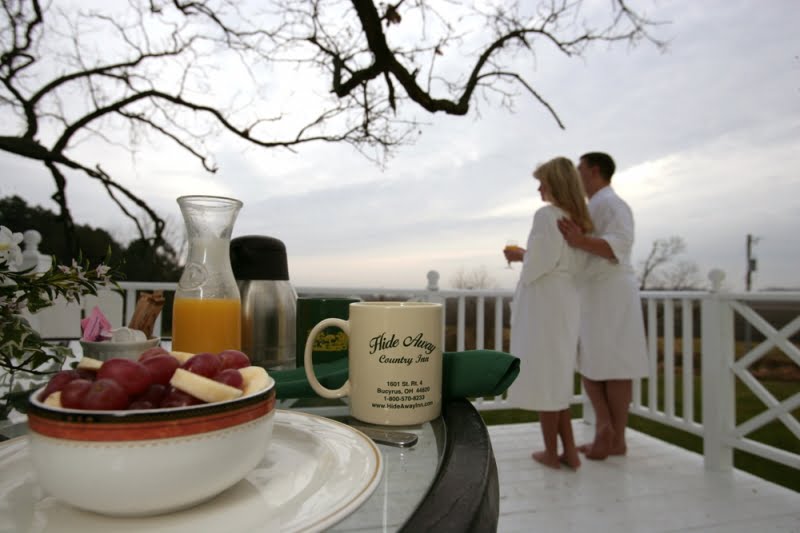 food and guests on the deck of the HideAway treehouse suite