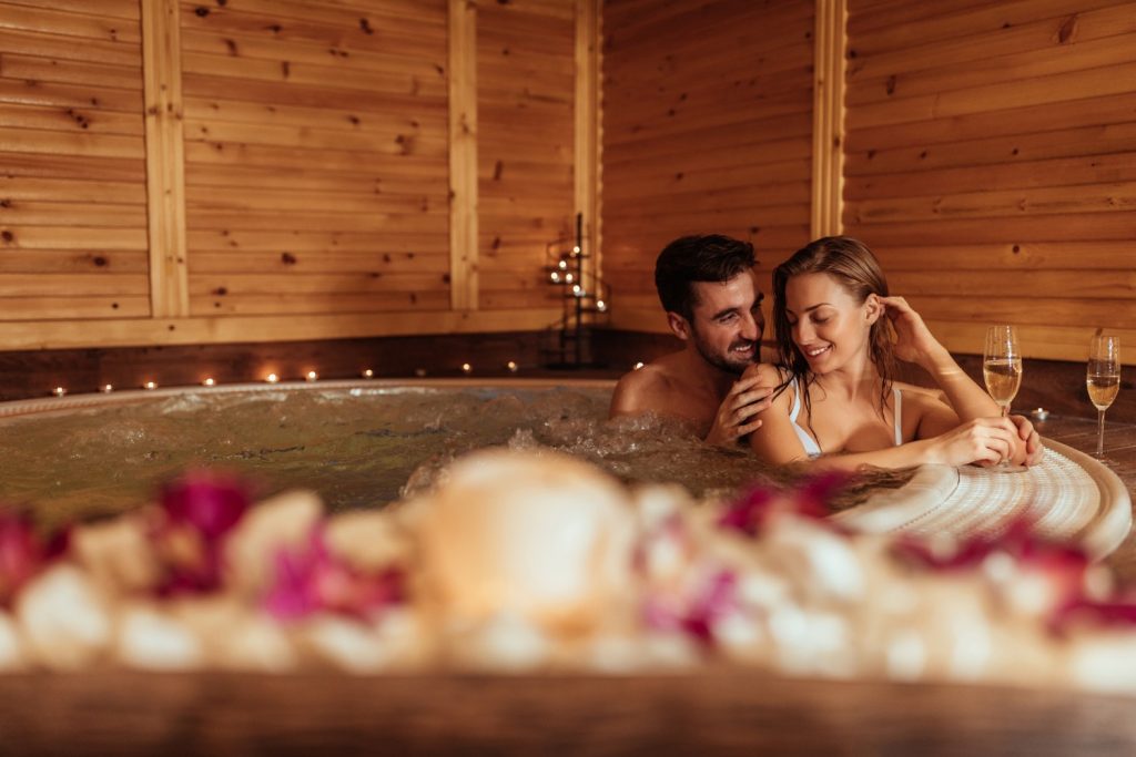 Couple enjoying an Ohio getaway with a hot tub.