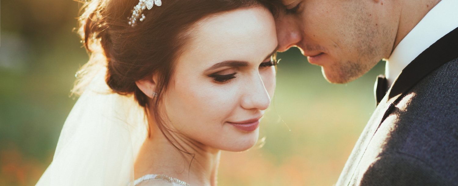 Sensual portrait of a young couple. Wedding photo outdoor Couple on their wedding day