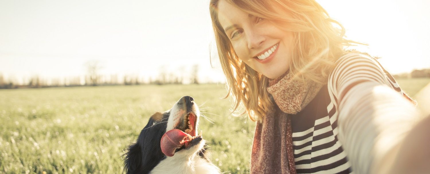 Woman traveling with her dog to pet friendly inn in Central Ohio Woman traveling with her dog to pet friendly inn in Central Ohio