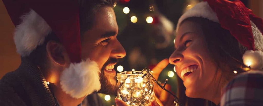 couple romance santa hats christmas